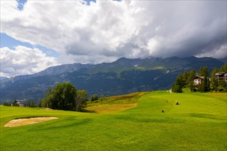 Crans Sur Sierre Golf Course with Hole 7 and Mountain View in Crans Montana in Valais