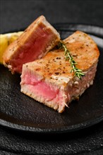 Closeup view of roasted tuna steak on a plate