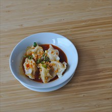 Asian Japanese Food Dumplings with chilli oil