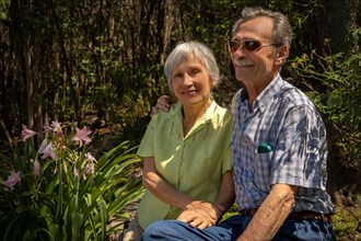 Close up portrait of beautiful senior couple in the park. Concept health insurance