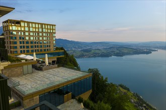Hotel Five Stars Buergenstock over Lake Lucerne and Mountain with Sunlight in Buergenstock