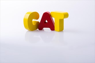 The word CAT written with colorful letter blocks