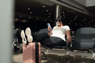 Airport Terminal: Woman Waits for Flight