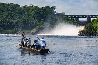 Fishermen fishing below the rapids on the Tshopo river