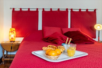 Breakfast on a red bed