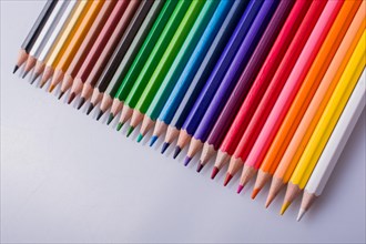 Color Pencils of Various colors placed on white background
