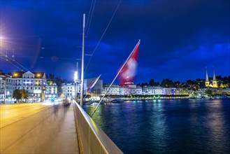 Bridge Over Reuss River with Cityscape at Night in Lucerne