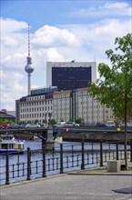 Picturesque setting on the banks of the Spree in the government district with a view of the TV tower on the Alex