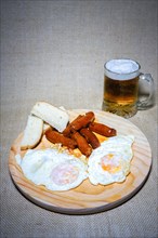 Typical Spanish meal of fried eggs with sausage