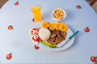 Tradicional lunch served at the table. Top view of traditional lunch with orange juice on the table