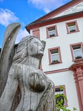 Wooden sculpture of an angel in front of the town hall of Sankt Blasien