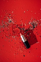 Cosmetics smear of smudged red lipstick on transperent glass