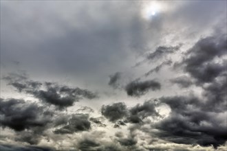 Sun shining through cloud cover