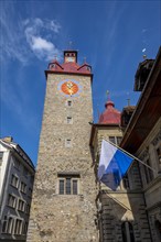 Town Hall of Lucerne with Flag and Blue Sky in Switzerland