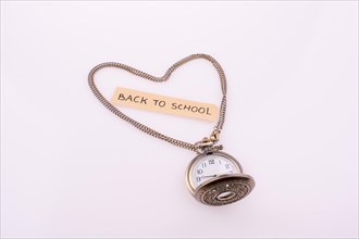 Heart shape formed by a pocket watch chain and back to school title