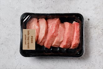 Top view of pork loin top roast in vacuum packaging