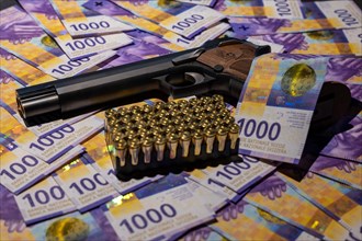 Elegant Semiautomatic 9mm Handgun with Swiss Helvetia Symbol Leaning on Swiss Franc 1000 Banknote and Bullet Ammunition in Switzerland