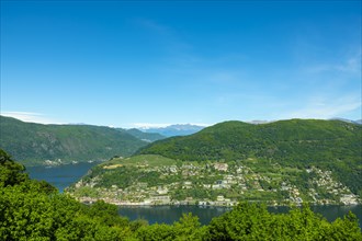 Aerail View over Morcote with Alpine Lake Lugano and Mountain in a Sunny Day in Ticino