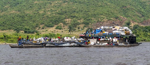 Overloaded riverboat on the Congo river
