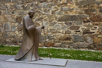 Monk statue in the inner courtyard of the collegiate church of Sankt Veit