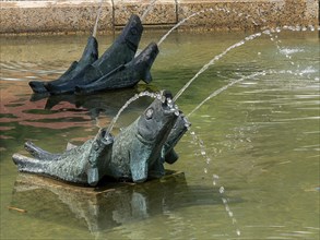 Waterspouting fish sculptures