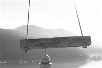 Empty Swing with Mountain View and Sunlight over Lake Lugano in Morcote