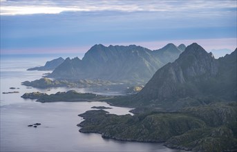 View of coast in Raftsund fjord and mountains in the evening light