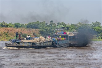 Overloaded riverboat on the Congo river