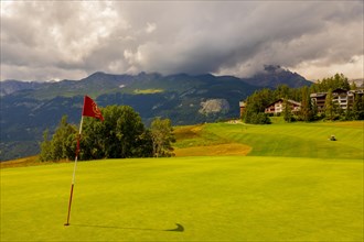 Crans Sur Sierre Golf Course with Hole 7 and Mountain View in Crans Montana in Valais
