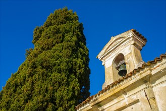 Church with Bell and a tree with Clear Blue Sky in Park San Michele in Castagnola in Lugano