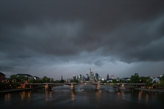 Storm and thunderstorm over the skyline and along the river Main