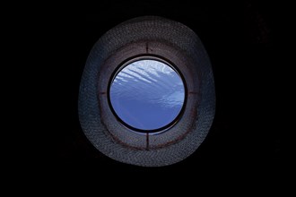 Ship Porthole in Underwater in Swimming Pool in a Sunny Day in Switzerland