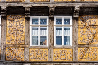 Frames with painted ornaments on one of the half-timbered houses typical of the World Heritage town on the Schlossberg