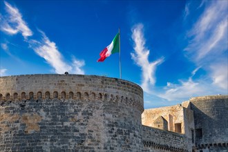 Italian flag on the Castelo in the fishing port of Gallipoli