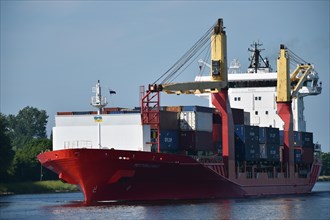 Container ship sailing through the Kiel Canal