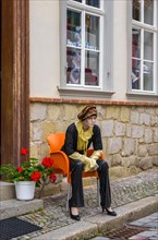 Mannequin in front of a fashion shop in the Gildschaft in the old town of the world heritage city