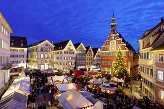 Medieval market and Christmas market against a backdrop of historic houses