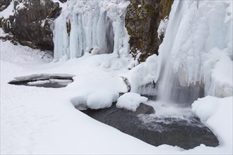 Frozen waterfall Kirkjufellsfoss in winter