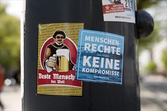 Sticker on a lamppost for Human Rights No Compromise