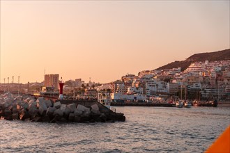 Tenerife ferry heading to Hierro or La Gomera from Los Cristianos. Beautiful sunset in the port