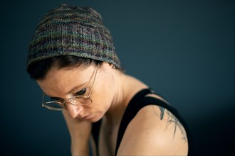 Woman with glasses and knitted cap