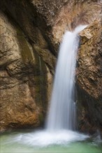 Waterfall in the river Almbach running through the Almbachklamm canyon in the Berchtesgaden Alps