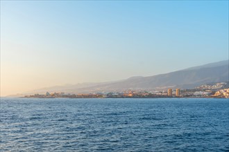 Tenerife ferry heading to Hierro or La Gomera. View from the boat of Los Cristianos and the island of Tenerife