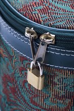 Travel case zipper locked with padloc
