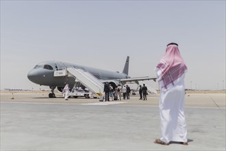 A man in traditional dress photographed in front of the Airbus A321 of the Air Force in Jeddah