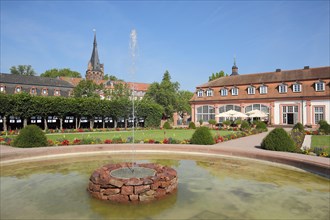 Baroque orangery with park and fountain with fountain