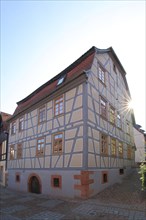 Half-timbered house in the backlight