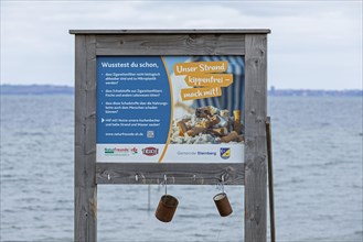 Sign asking smokers not to throw away cigarette butts on the beach
