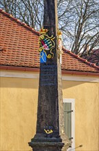Historic Electoral Saxon post office milepost in front of the main entrance to Moritzburg Castle near Dresden