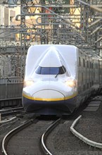 Shinkansen series E4 approaching Tokyo Station Asia